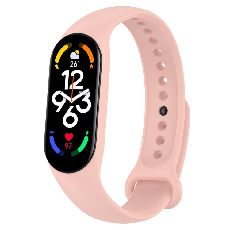 Light blush pink silicone smartwatch band with perforation holes and pin clasp, tracker display visible.