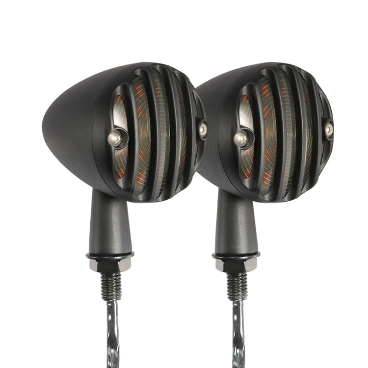 Black retro motorcycle LED turn signal pair, round ribbed lenses with amber glow.