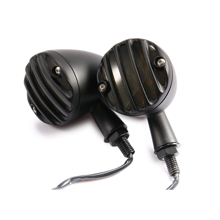 Black retro LED turn signal pair, angled housings with amber ribbed lenses and wires.