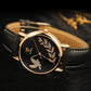 YAZOLE dove motif leather band watch, black strap, black dial, rose-gold case close-up