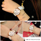 Round wristwatch on wrist with white leather band and gold case, peace dove and leaf design