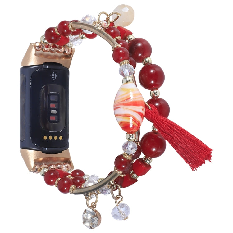 Bead chain watch band with red beads and glass charms, gold links, red tassel