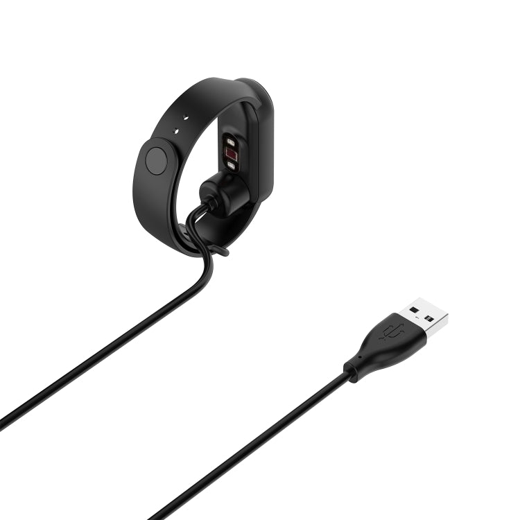 Magnetic charging cable with USB-A plug, shown docked to a smartwatch.