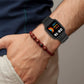 Black silicone smartwatch band worn on a man’s wrist with fitness screen visible