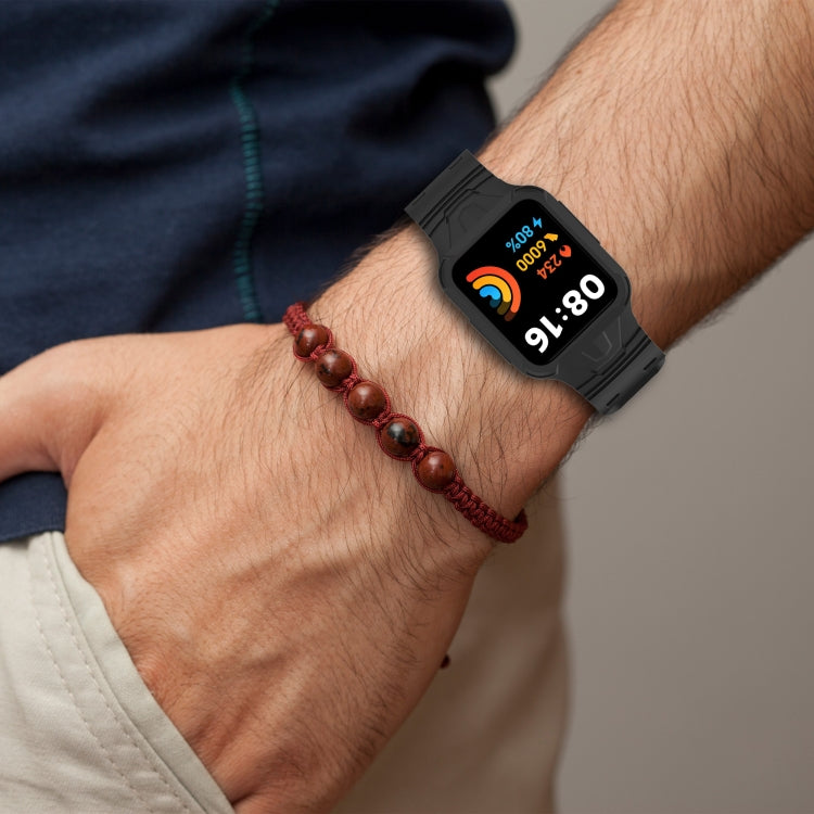 Black silicone smartwatch band worn on a man’s wrist with fitness screen visible