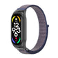Black smartwatch with navy and purple nylon mesh watch band