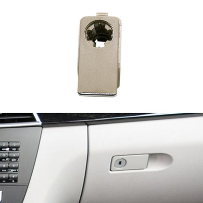 Beige glove box handle switch with circular connector opening
