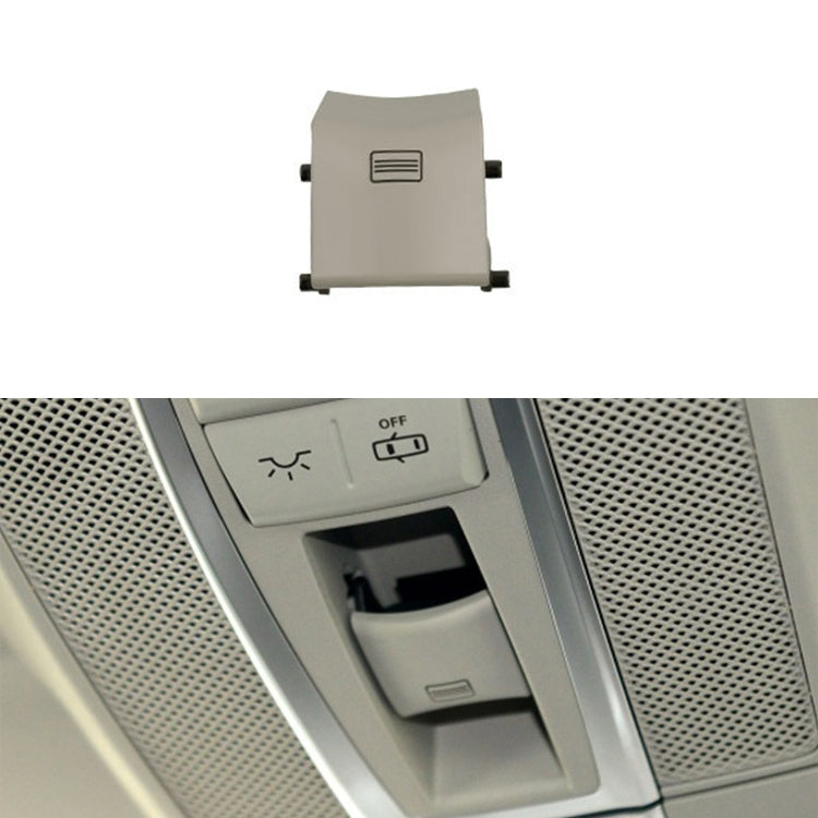 Light beige sunroof dome light switch button with vent-style icon and side mounting tabs