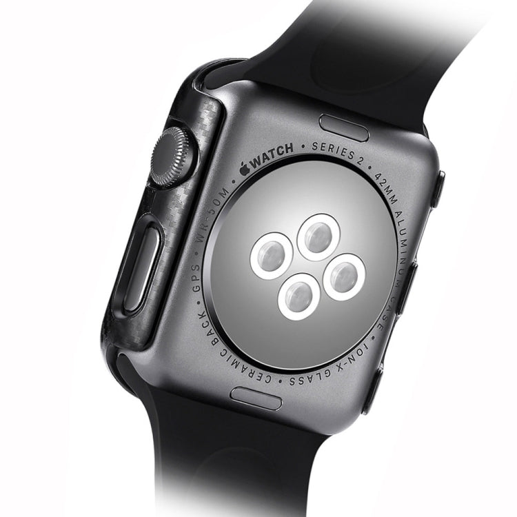 Carbon fiber watch case covering the back, dark frame with side buttons and cutouts