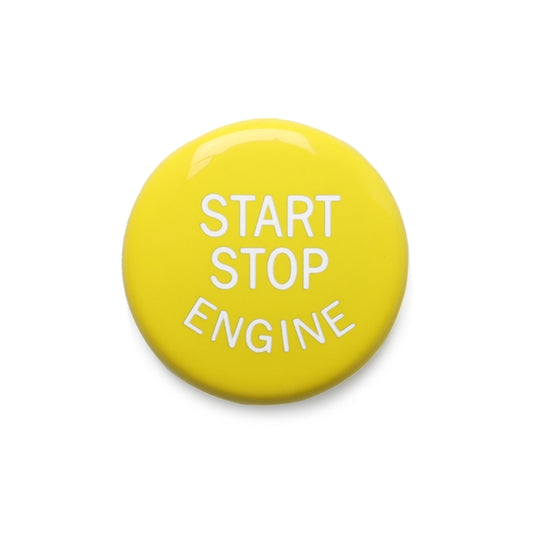 Close-up yellow START STOP ENGINE engine start/stop button