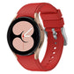 Red silicone watch band with metal clasp and perforated strap holes