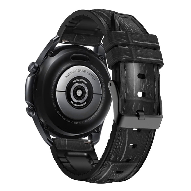Black textured silicone watch band, side view, with metal buckle and strap holes