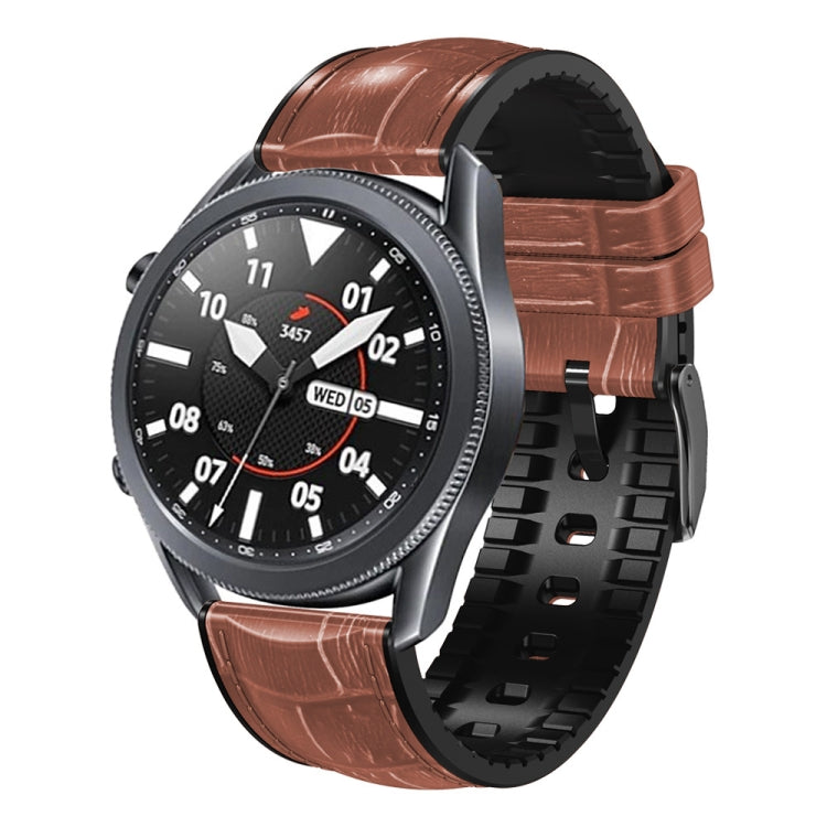 Brown textured silicone watch band with metal buckle and strap holes, side view