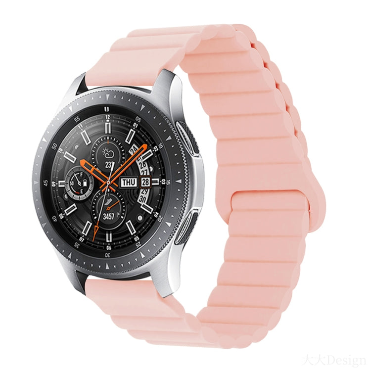 Smart watch with pink silicone band and metal clasp, round black dial with orange details