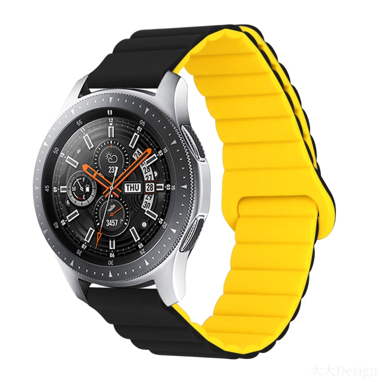 Smart watch with yellow silicone band and metal clasp, round black dial with orange details