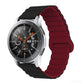 Smart watch with maroon silicone band and metal clasp, round black dial with orange details