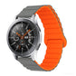 Orange ribbed silicone watch band with foldover clasp detail