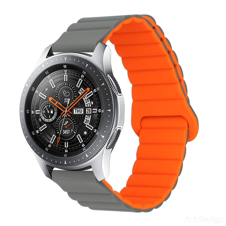 Orange ribbed silicone watch band with foldover clasp detail