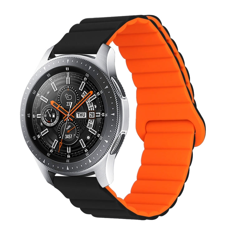 Orange silicone watch band with reverse buckle and magnetic clasp, segmented links.