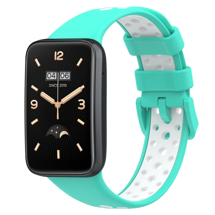 Two-color breathable silicone watch band with perforations, mint teal and white, buckle clasp.