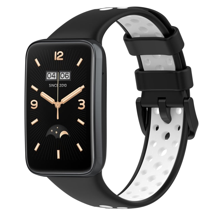 Two-color breathable silicone watch band with perforations, black and white, buckle clasp.