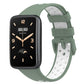 Two-color breathable silicone watch band with perforations, light green and white, buckle clasp.