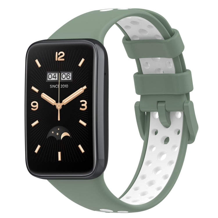 Two-color breathable silicone watch band with perforations, light green and white, buckle clasp.