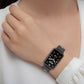 Black breathable silicone smartwatch band with perforated gray inner on wrist