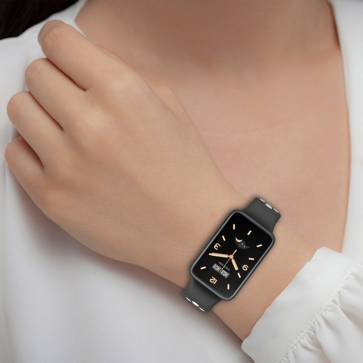 Black breathable silicone smartwatch band with perforated gray inner on wrist