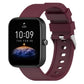 Burgundy silicone watch band with metal buckle and perforated strap holes