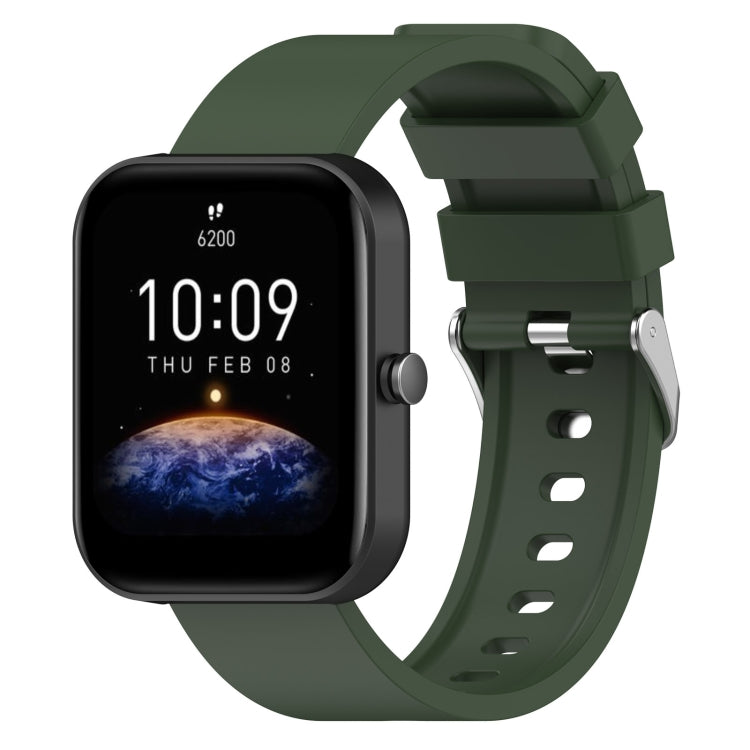 Dark green silicone watch band with metal buckle and perforated strap holes