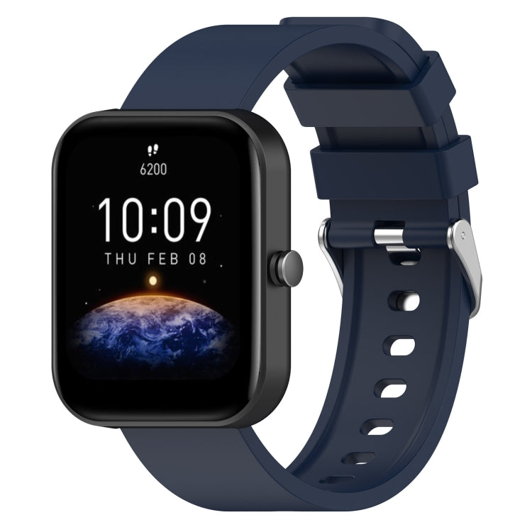 Navy blue silicone watch band with metal buckle and perforated strap holes