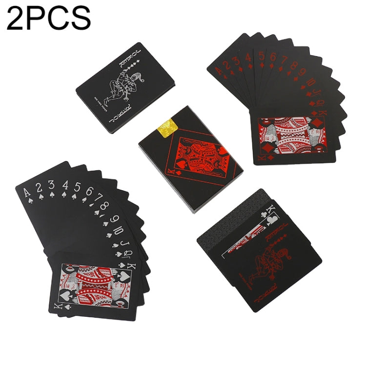 Plastic waterproof poker cards spread, black with red suit designs and card backs.