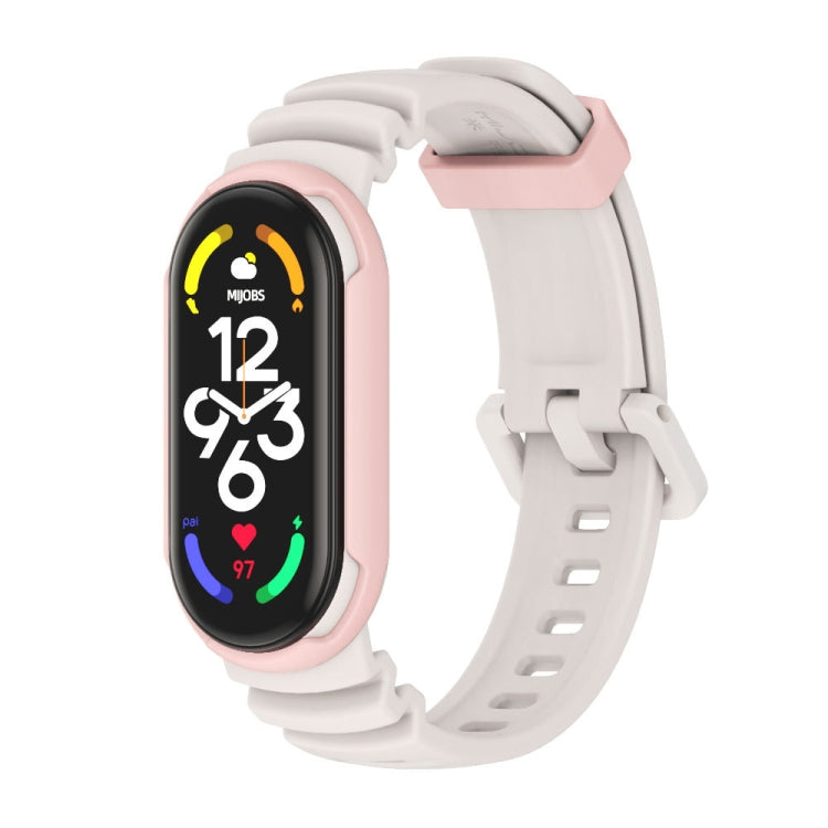 Two-color watch band with light pink strap and matching pink connector for fitness tracker