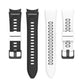 Silicone watch strap pair: black and white perforated bands with metal buckle.