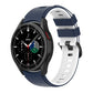 Two-color silicone watch strap with navy blue and white perforated links, for smartwatch.