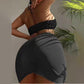 Black ruched swim skirt with side tie and black halter bikini top, backless style