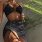 Black backless halter bikini top with ring detail and ruched wrap short skirt, side slit