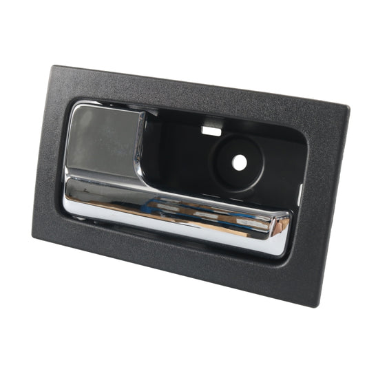 Left front interior door handle, black bezel with chrome lever and circular insert