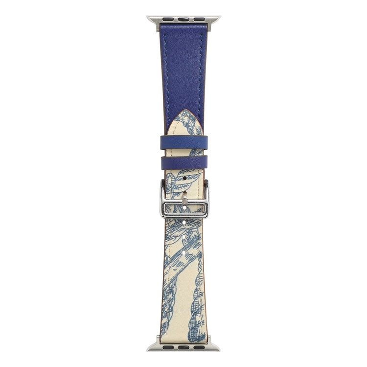 Blue watch strap with metal buckle, stitched holes, and patterned underside.