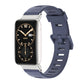 TPU watch band with perforated holes and silver-toned case, dark blue strap