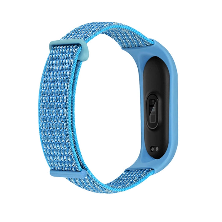 Two-section loop watch band with blue woven strap and light-blue smartwatch case