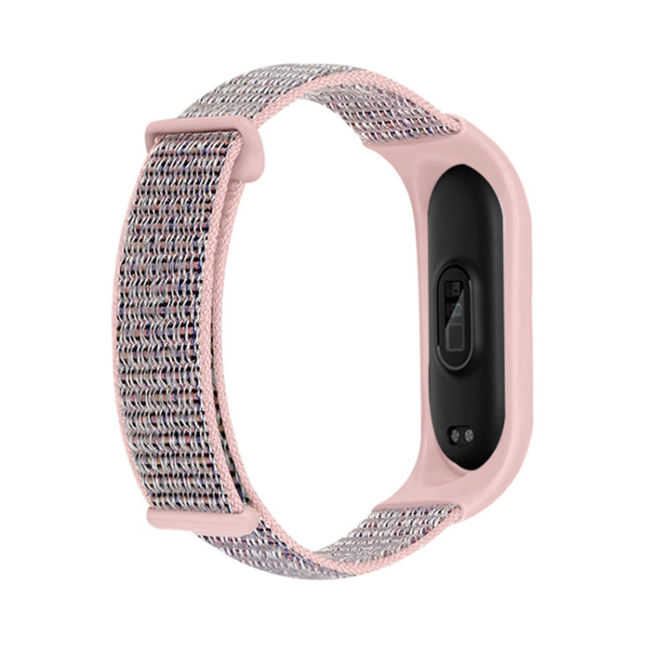 Two-section loop watch band with pink case and gray woven strap, side profile