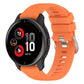 Orange silicone watch band with cross-textured finish and clasp hardware