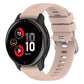 Light pink silicone watch band with cross-textured finish and clasp hardware