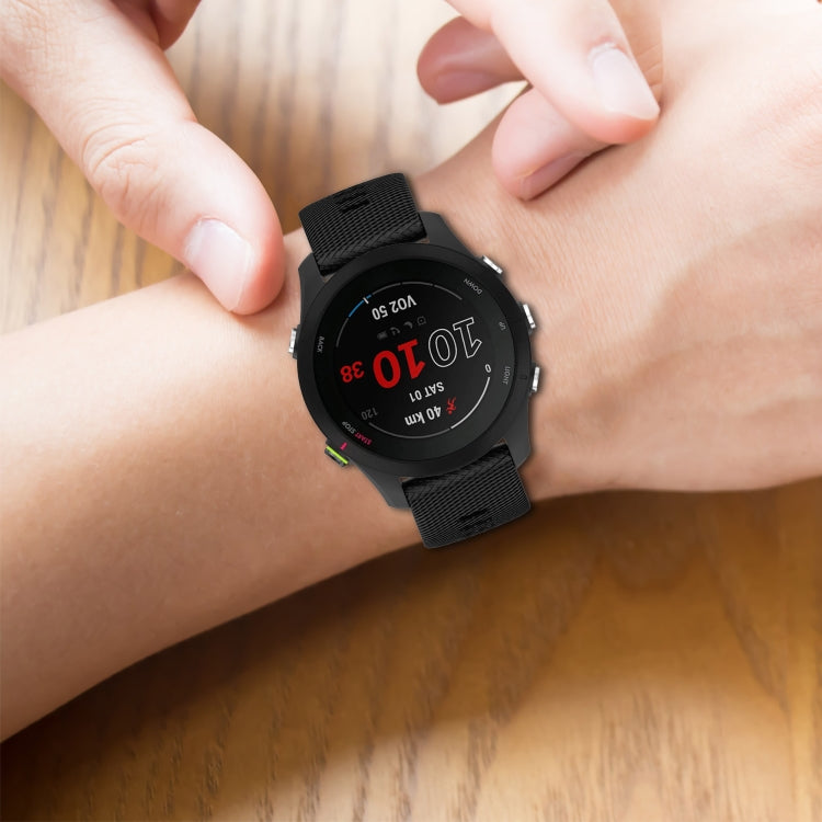 Cross-textured silicone watch band, black strap worn on wrist