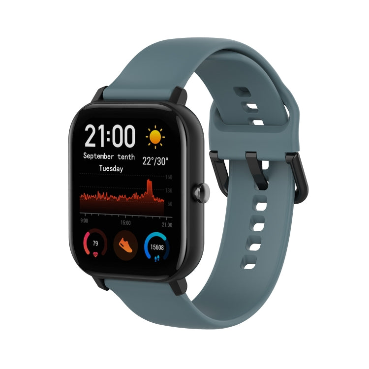 Blue-gray soft silicone watch band with perforated holes and buckle clasp