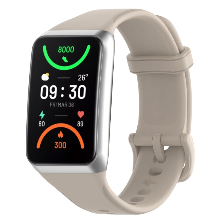 Light beige soft silicone watch band with adjustable holes and buckle clasp.