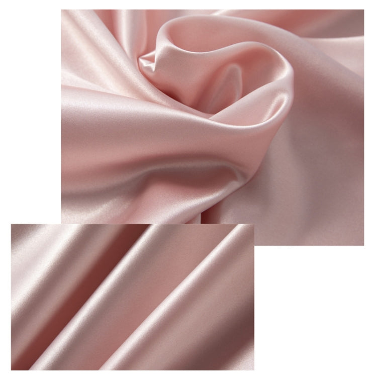 Blush pink satin nightdress fabric close-up with soft sheen
