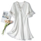 Loose V-neck mid-sleeve nightdress in white with scalloped lace trim and decorative bow